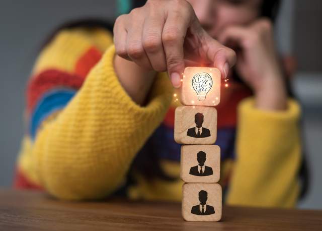 Person stacking blocks