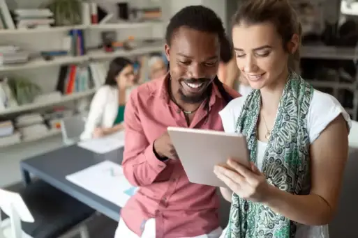 Two students looking at a notebook