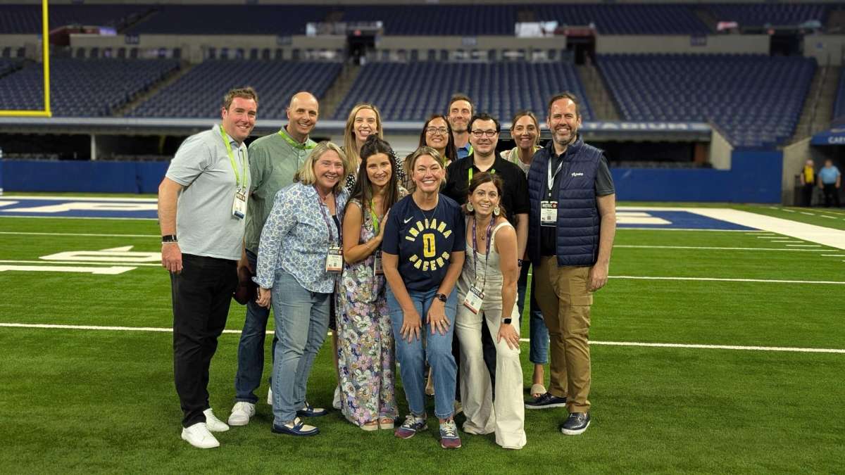 Flywire team at Lucas Oil Stadium during HITEC